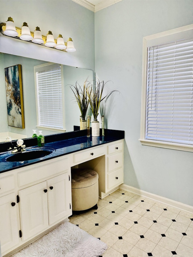 bathroom with crown molding and vanity