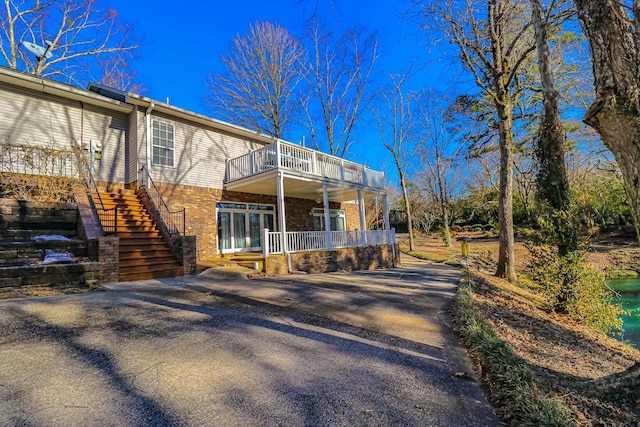 back of house with a balcony