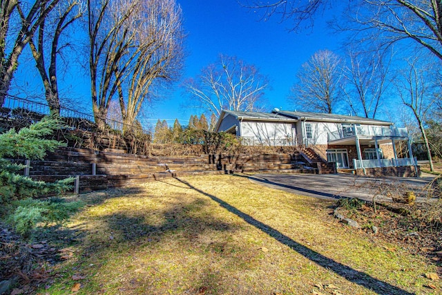 view of yard with a wooden deck