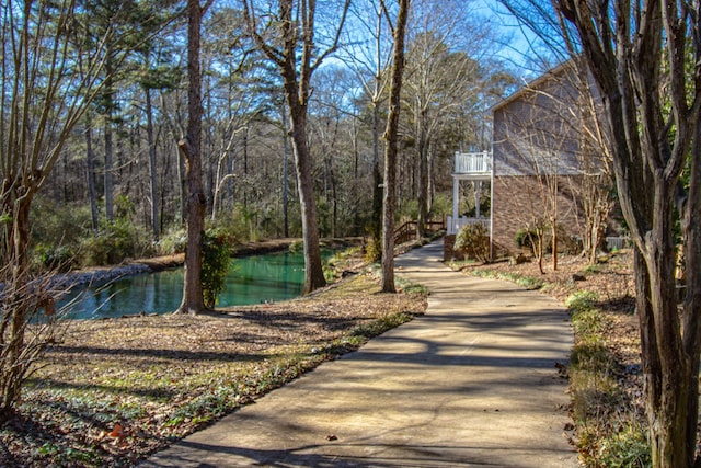 view of community with a water view