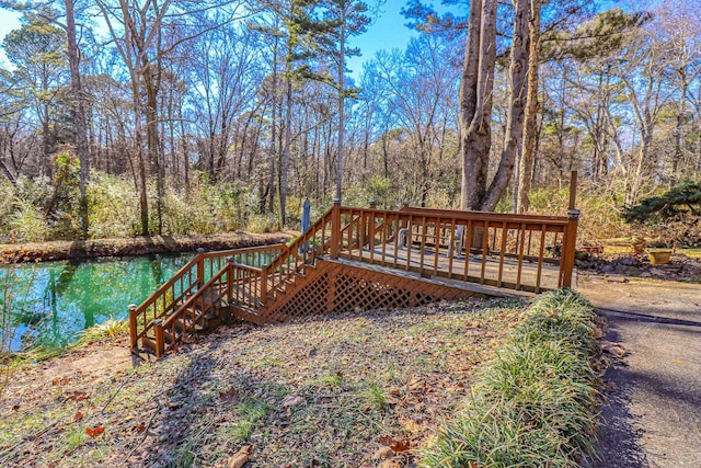 wooden deck featuring a water view