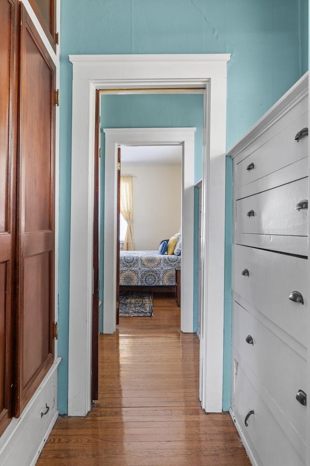 corridor featuring wood finished floors