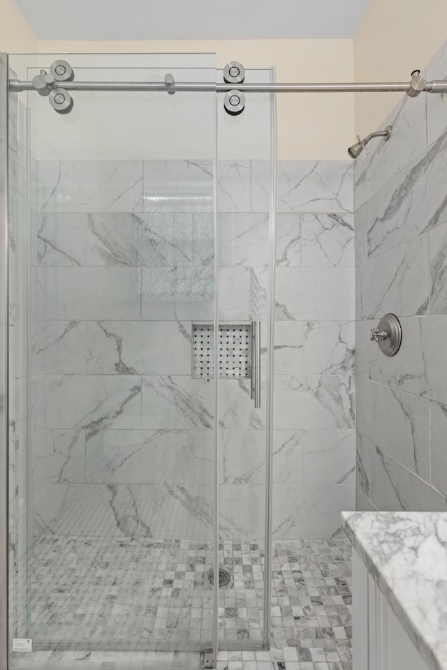 full bath featuring vanity and a stall shower