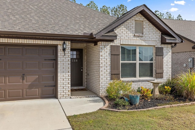 view of exterior entry featuring a garage