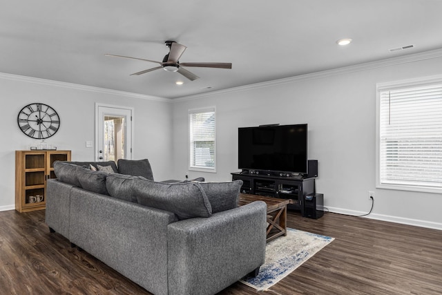 living room with dark hardwood / wood-style floors, ceiling fan, and crown molding