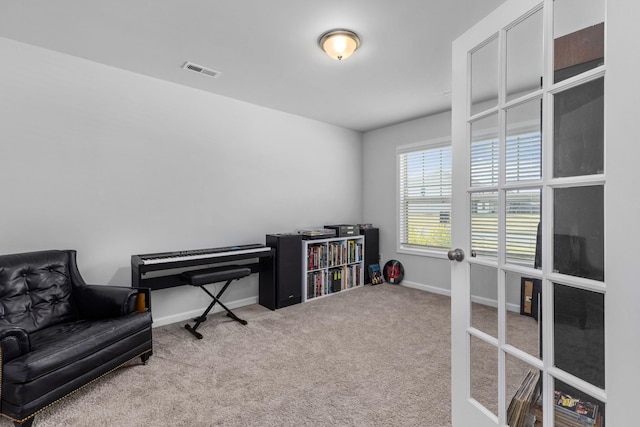 misc room with french doors and carpet floors