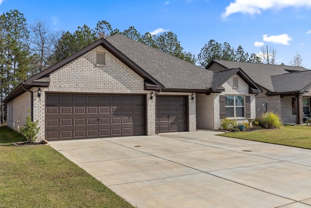 view of front facade featuring a front yard and a garage