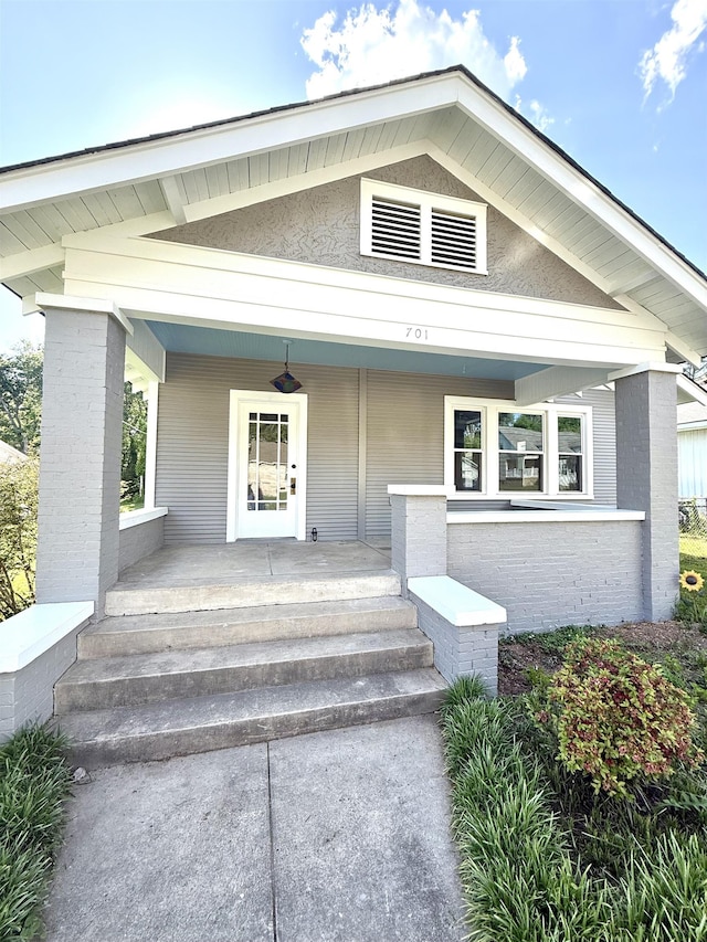  - view of exterior entry featuring covered porch