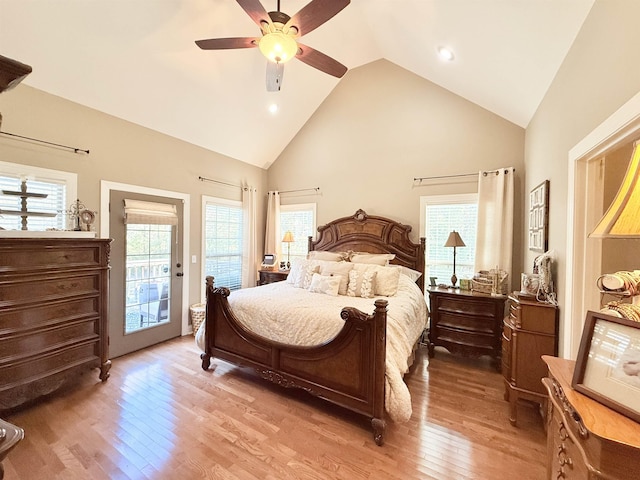 bedroom with light wood-type flooring, access to outside, high vaulted ceiling, and ceiling fan