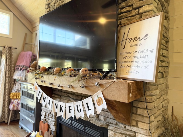 details with hardwood / wood-style floors and a fireplace