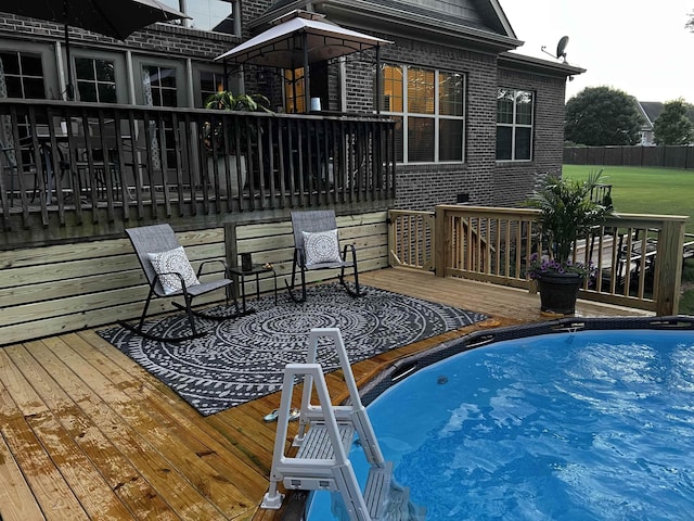 view of pool with a wooden deck