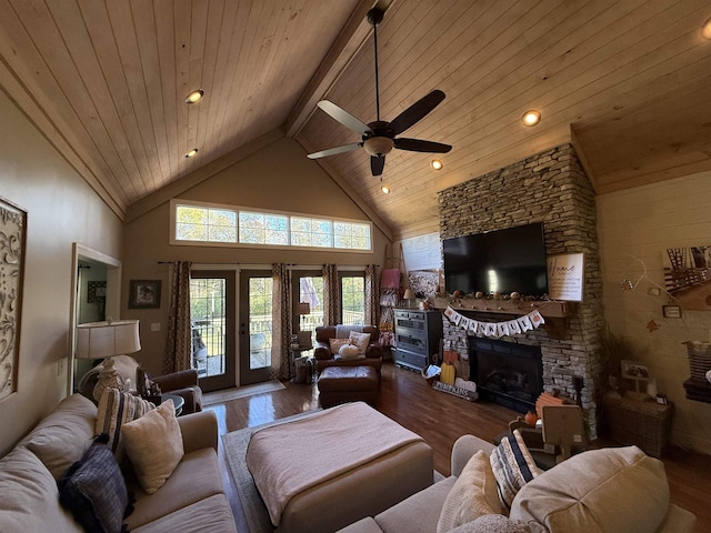 living room featuring a fireplace, hardwood / wood-style floors, high vaulted ceiling, and ceiling fan