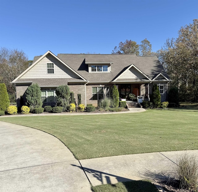 craftsman-style house featuring a front lawn