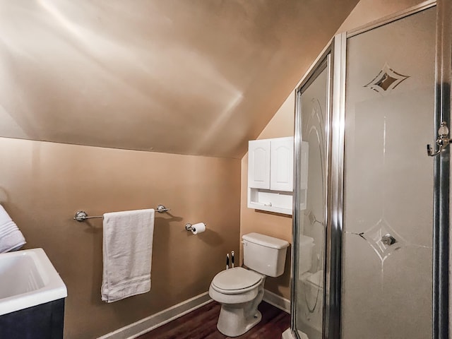 bathroom featuring hardwood / wood-style floors, a shower with door, sink, vaulted ceiling, and toilet