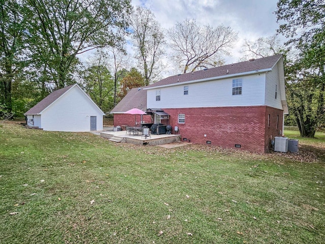 back of property featuring a lawn, a gazebo, and a deck