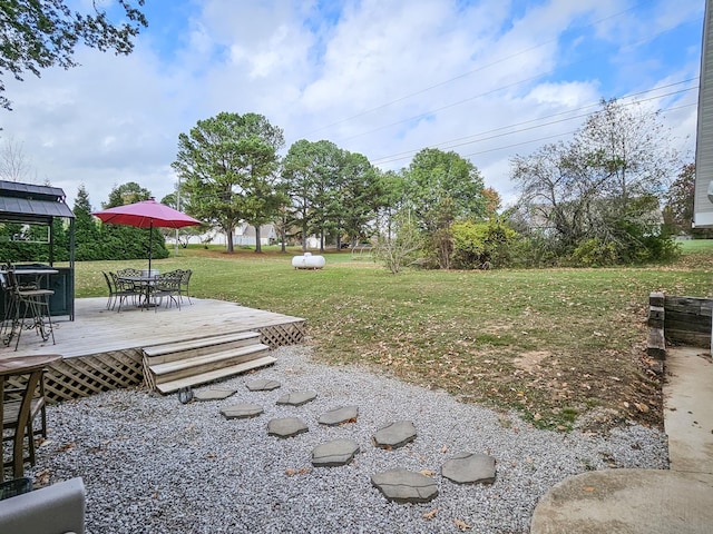 view of yard featuring a gazebo and a deck