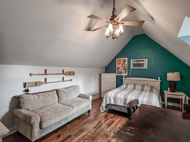 bedroom with ceiling fan, wood-type flooring, a wall unit AC, and lofted ceiling