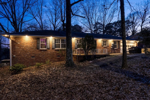 single story home with crawl space, brick siding, and an attached garage