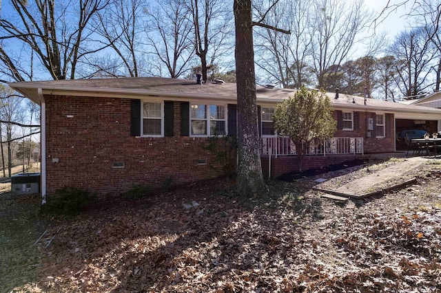 view of property exterior with crawl space and brick siding