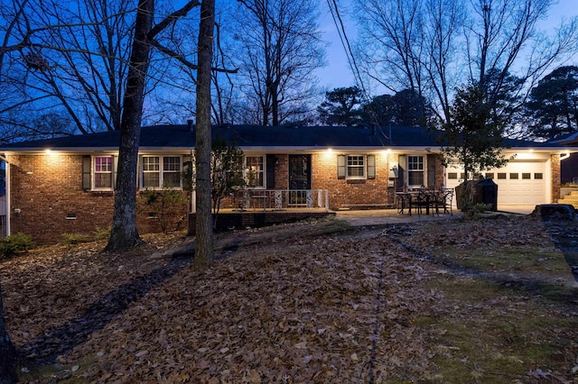 ranch-style house with crawl space, brick siding, and an attached garage