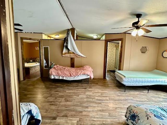  - bedroom featuring wood finished floors