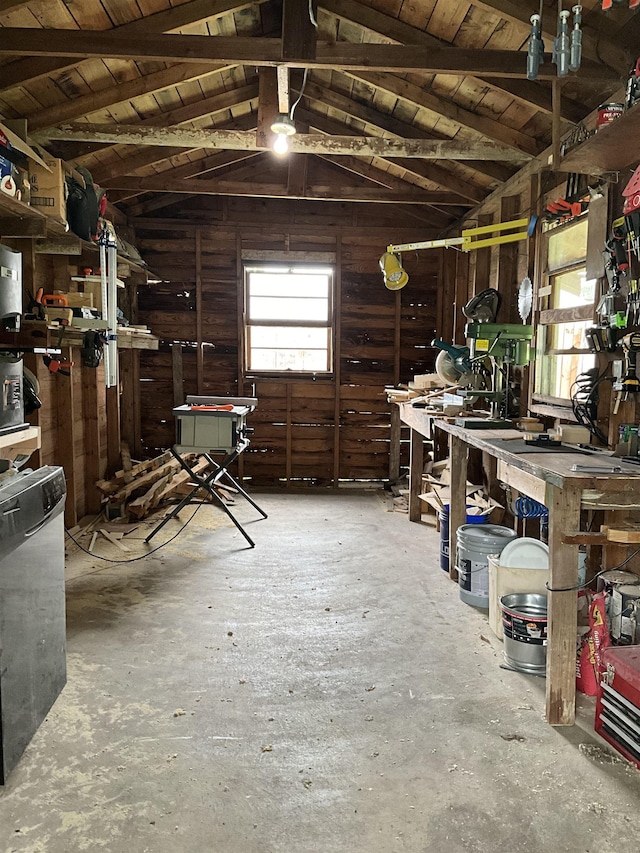 miscellaneous room with a workshop area, lofted ceiling with beams, and wood ceiling