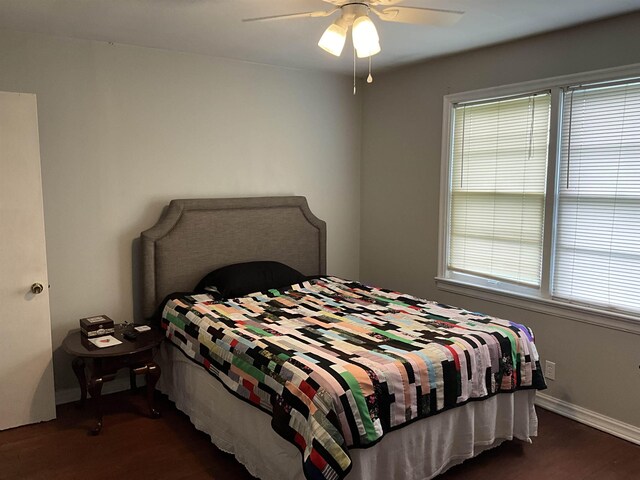 bedroom featuring ceiling fan and dark wood-type flooring