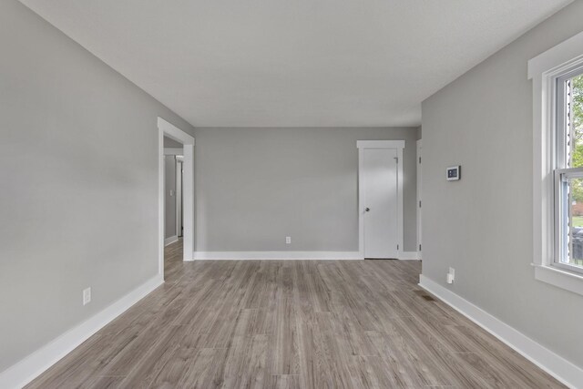  - empty room featuring wood finished floors