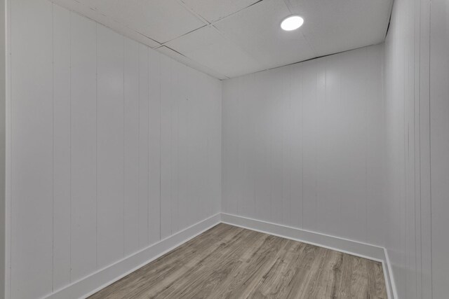  - spare room with light wood finished floors and a drop ceiling