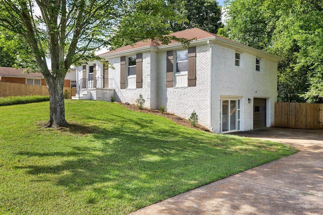  - view of front of house featuring driveway, brick siding, and an attached garage