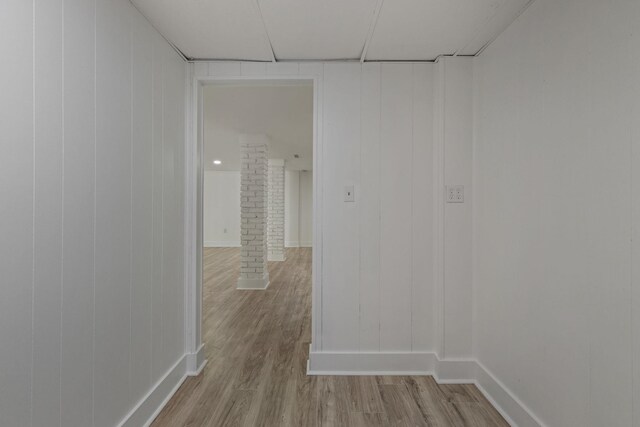  - empty room with ornate columns and wood finished floors