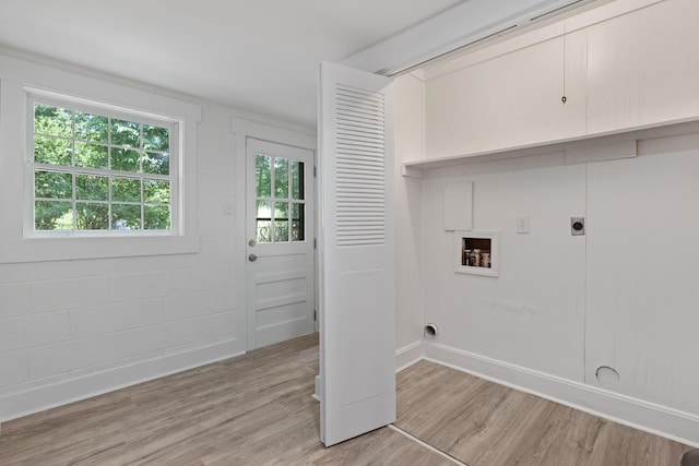 - laundry room with hookup for an electric dryer, light wood-style flooring, and washer hookup