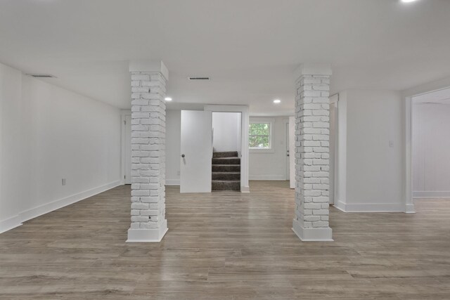  - below grade area featuring wood finished floors, stairway, and recessed lighting