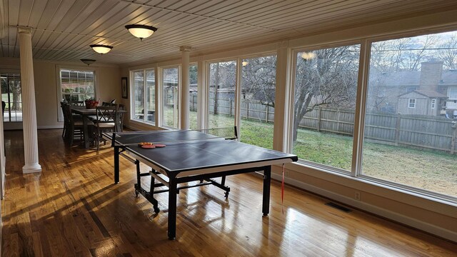 dining room with wood ceiling, ornamental molding, and wood-type flooring