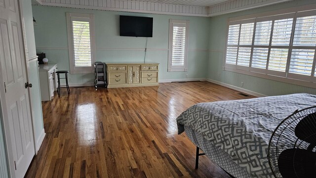 playroom featuring crown molding, wood-type flooring, and a wealth of natural light