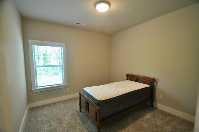  - bedroom with carpet floors and baseboards