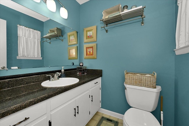  - half bathroom featuring toilet and vanity