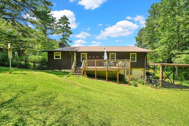  - rear view of property featuring a deck and a chimney