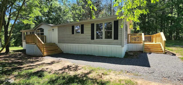  - view of front of home featuring a deck