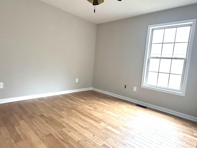 unfurnished room with light hardwood / wood-style floors and ceiling fan