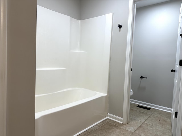 bathroom with tile patterned floors