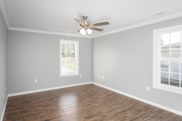 unfurnished room with plenty of natural light, dark wood-style floors, and visible vents