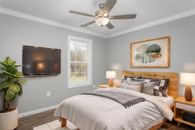 bedroom featuring ceiling fan, wood finished floors, baseboards, and ornamental molding