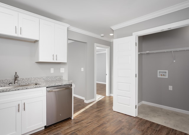 kitchen featuring ornamental molding, stainless steel dishwasher, dark wood-style floors, white cabinets, and a sink