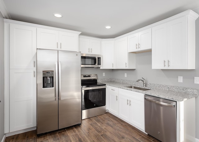 kitchen featuring a sink, dark wood-style floors, white cabinetry, and stainless steel appliances