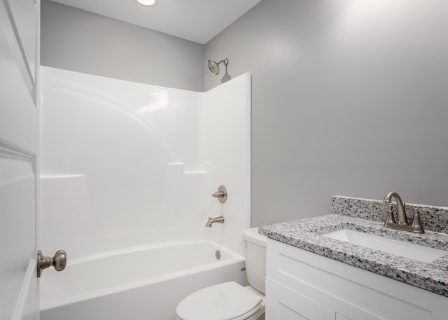 full bathroom featuring vanity, toilet, and washtub / shower combination