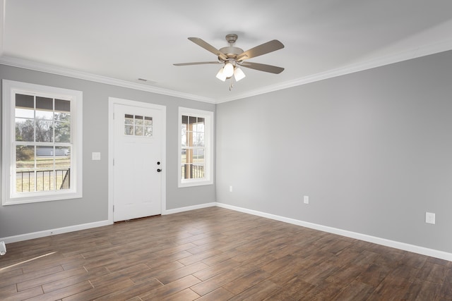 entrance foyer with visible vents, crown molding, baseboards, ceiling fan, and dark wood-style flooring