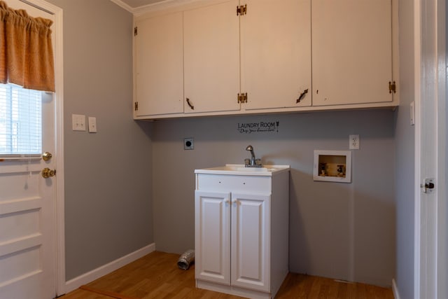 clothes washing area with washer hookup, sink, light hardwood / wood-style floors, and hookup for an electric dryer