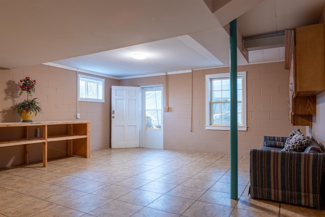 tiled foyer entrance with crown molding