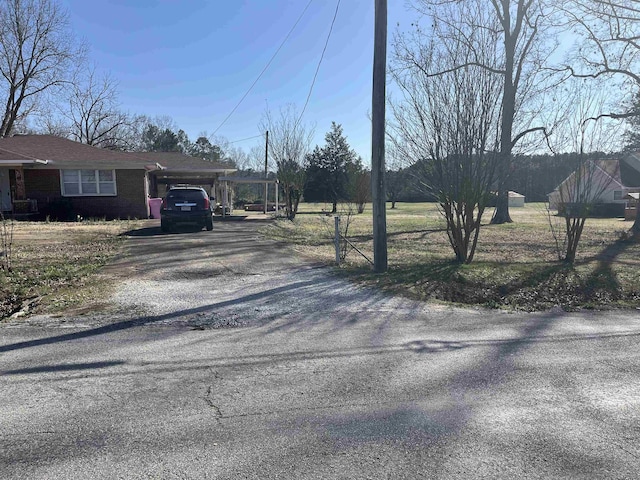 view of road with driveway